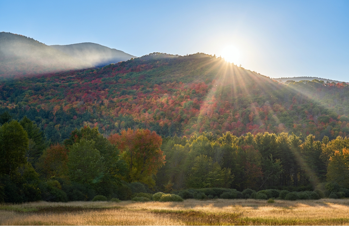 Forested peaks and open water in the Adirondack Park
